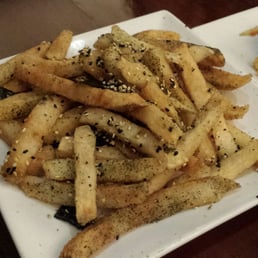 House fries with truffle oil, sesame seeds, and buts of seaweed