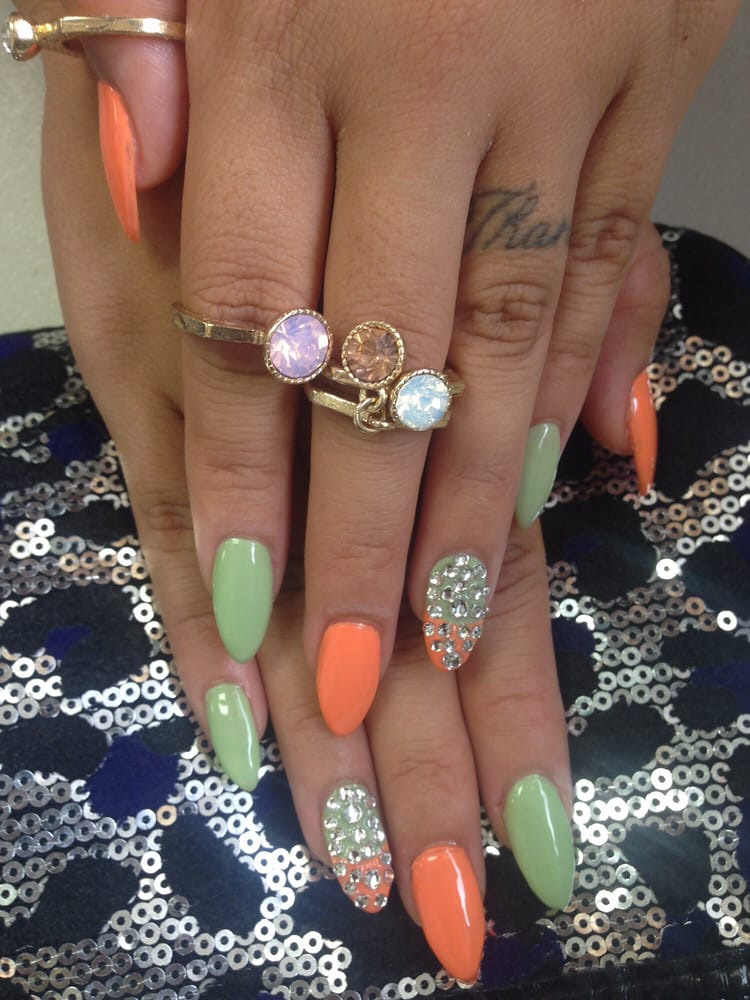 Hallie is amazing! Orange and green almond shaped nails with