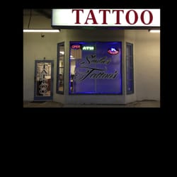 Smilie's Tattoo's and Body Piercing logo