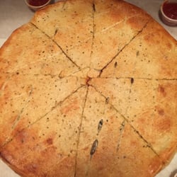 Massino's Pizzeria logo