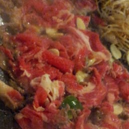 Oh! My SamGyupSal - Duluth, GA, United States. Wonderful grilled beef brisket with added garlic slices and jalapenos.