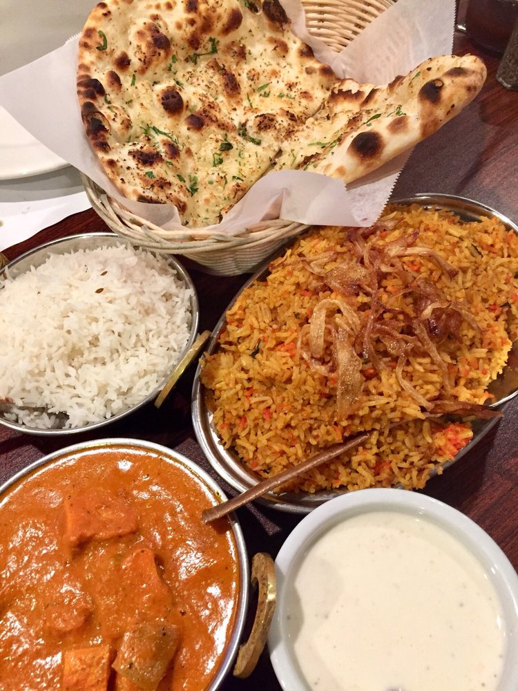 Photo of Everest Curry Kitchen - Sandy, UT, United States. Chicken Tikka Masala and a lamb rice dish
