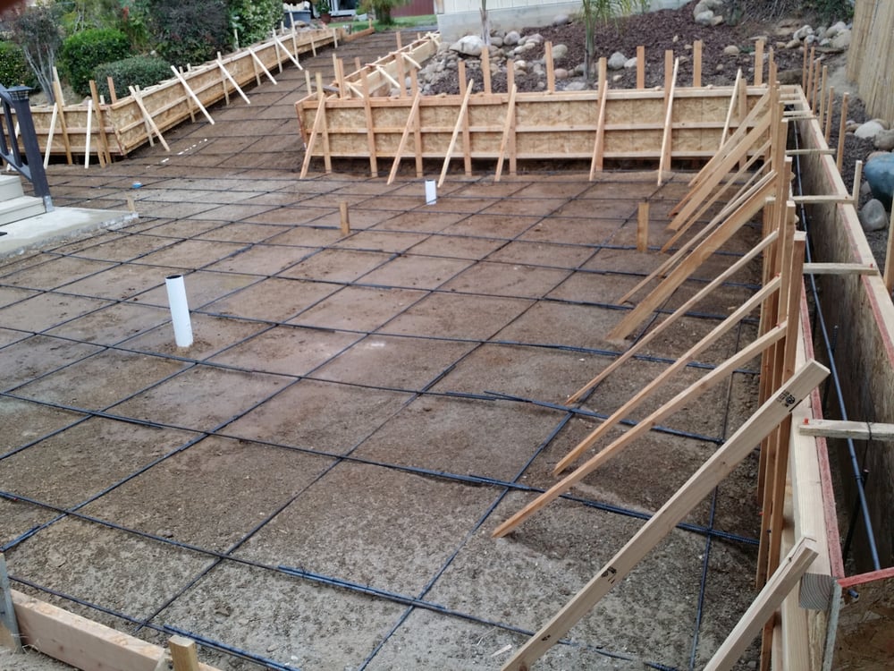 Set up poured in place retaining wall and slab ...