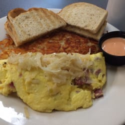 Omelette & Waffle Cafe - Plymouth, MI, United States. The Reuben Omellette - first time I had Thousand Island dressing for breakfast.
