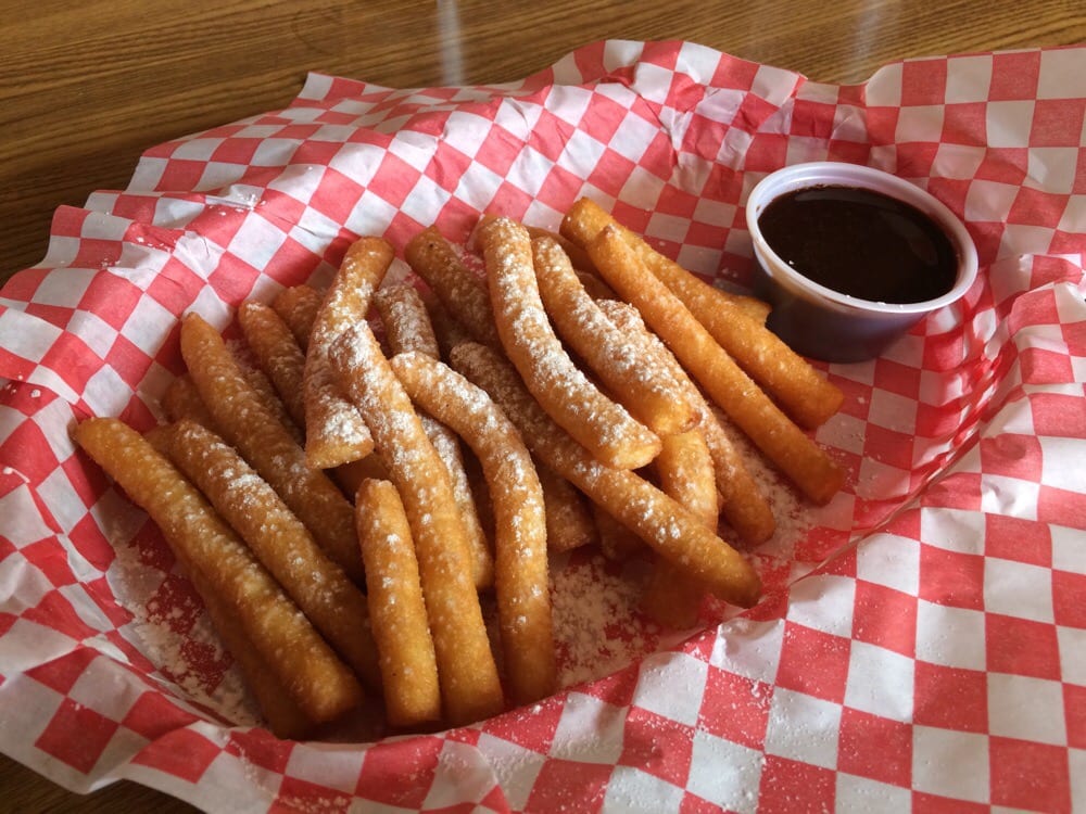 Funnel cake fries with chocolate sauce for dipping.. Yep