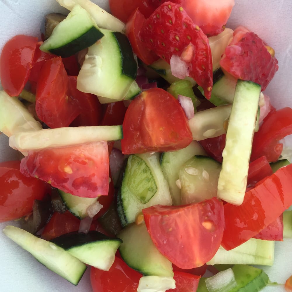 Chopped lettuceless salad with tomatoes, cucumbers, red onions, celery