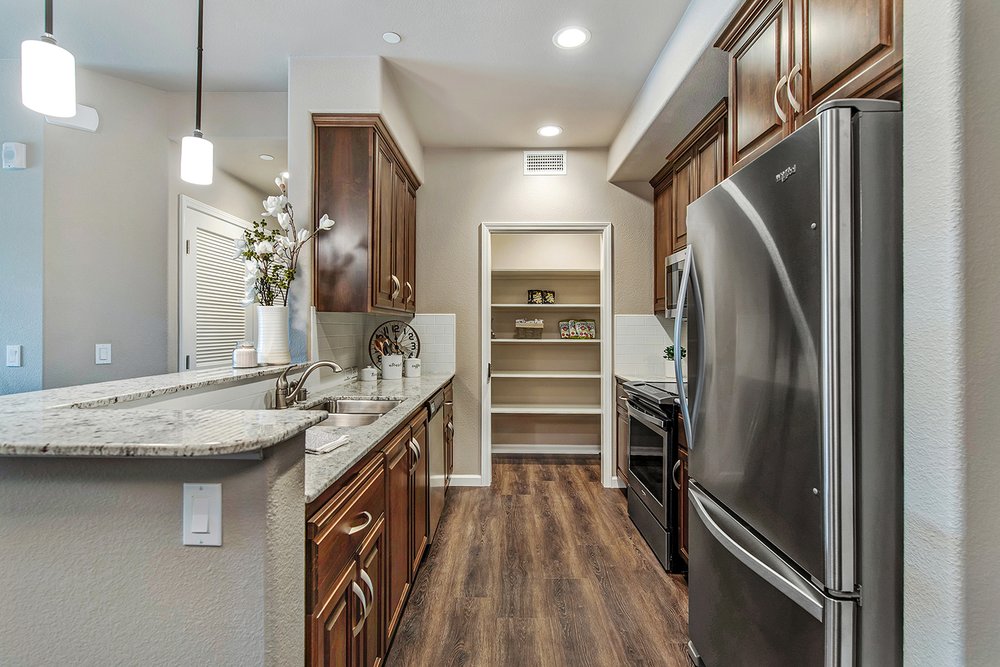 Gourmet Kitchen With Stainless Steel Appliances And Espresso