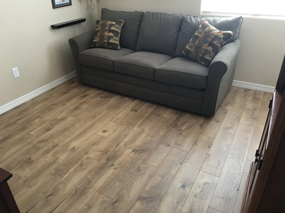Complete Flooring Installed Century Oak Laminate In A Guest