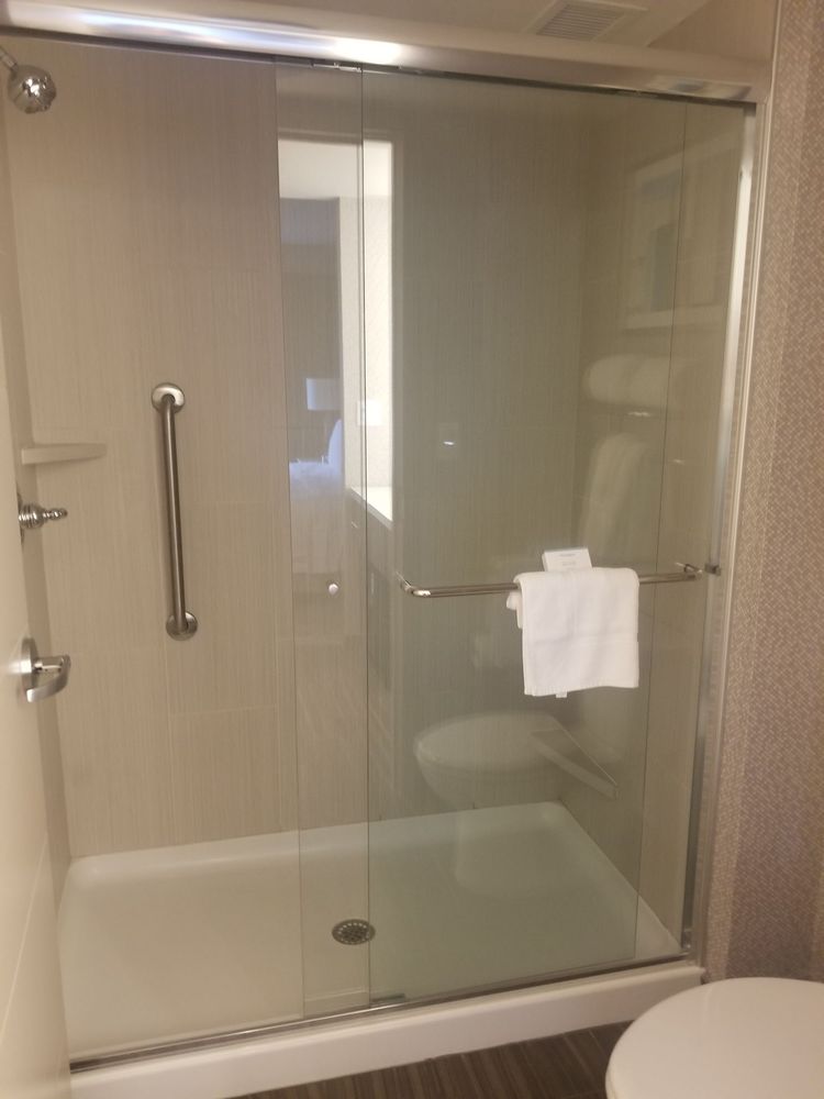 Nice Sliding Glass Door On The Shower And Head With