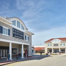 What are some outlet stores in Wrentham Village?