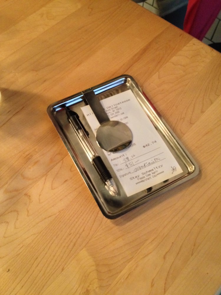 Cool check presenter and a fantastic meal! Yelp