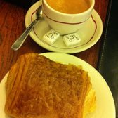 Photo of Pâtisserie Viennoise , Paris, France. Chocolate croissant + coffee/espresso