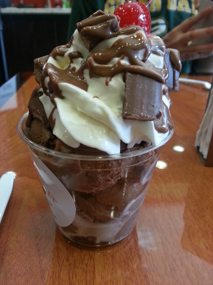 Kit kat sundae with a scoop of chocolate ice cream and a scoop of rocky