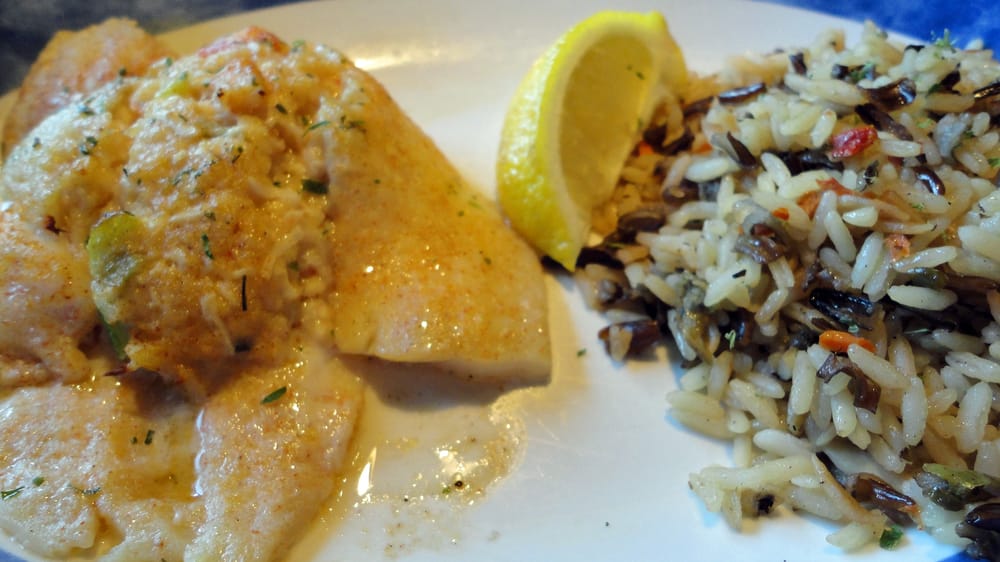 Seafood stuffed flounder with a rice pilaf Yelp