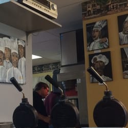 Omelette & Waffle Cafe - Plymouth, MI, United States. Great chef paintings throughout the restaurant.