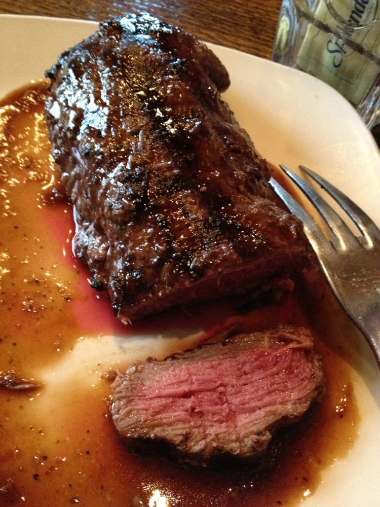 Cut into medium rare sirloin steak. Cooked just right retaining