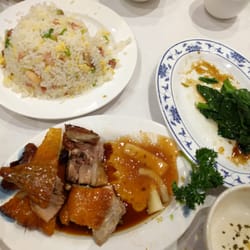 Photo of King of Kings Seafood Restaurant - Fortitude Valley Queensland, Australia. Fried rice, roasted duck, and veggies.