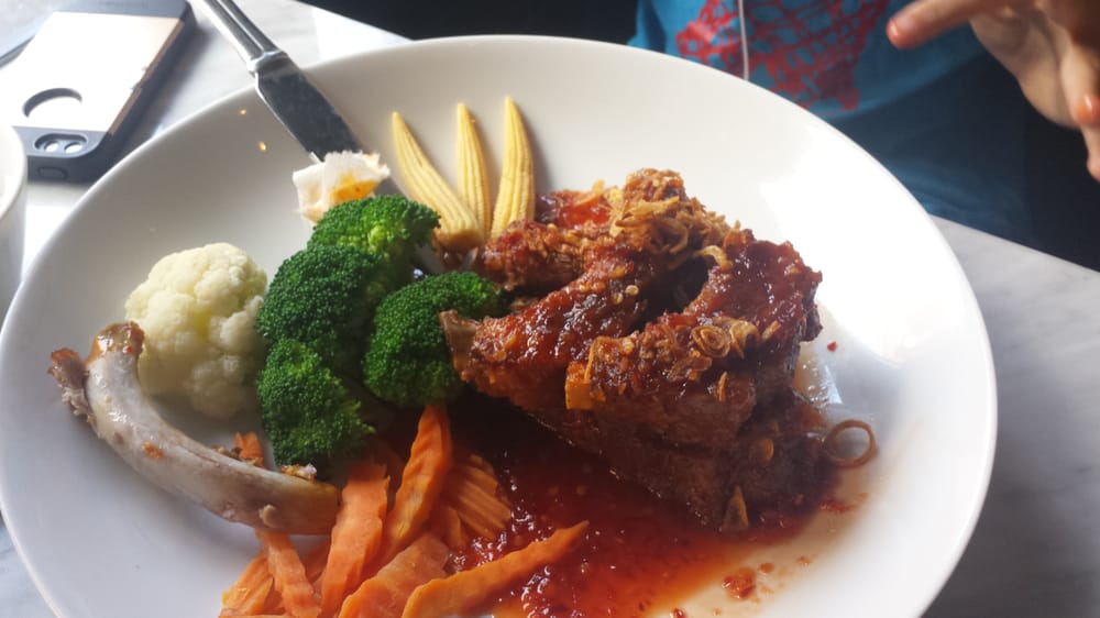 Photo of Kitchen 79 - Jackson Heights, NY, United States. Ribs that the Kid ordered: Â He liked this well enough because..meat! Â  But I was not a fan of the random veggies that came with it.