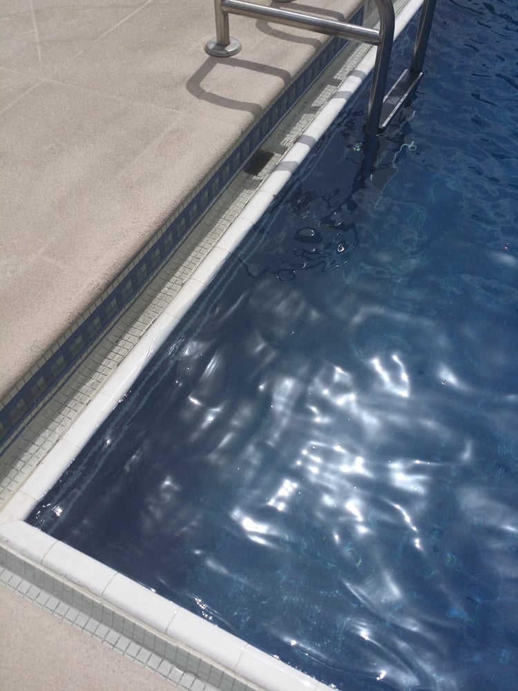 Oily film floating on the top surface of the pool water Yelp