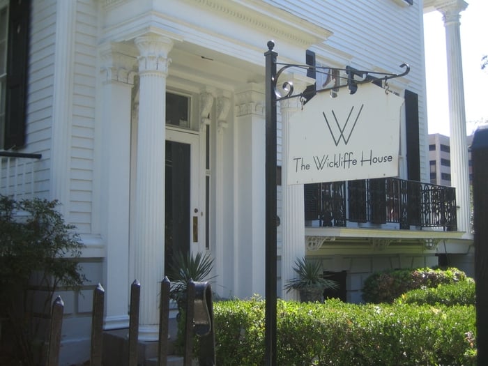 Sign at the entrance to the house Yelp