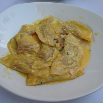 Photo of Buona Tavola - Paso Robles, CA, United States. Agnolotti stuffed with shrimp, braised onion and prosciutto in a saffron cream sauce