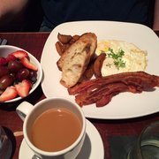 Vinology - Ann Arbor, MI, United States. Eggs Your Way w side of fruit and coffee. Great coffee better potatoes and eggs cooked to order.